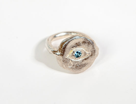 ring with blue aquamarine set in eye