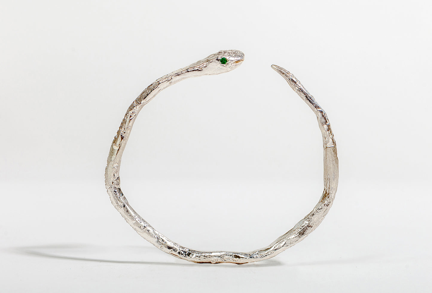 SILVER SNAKE BANGLE WITH EMERALD EYES